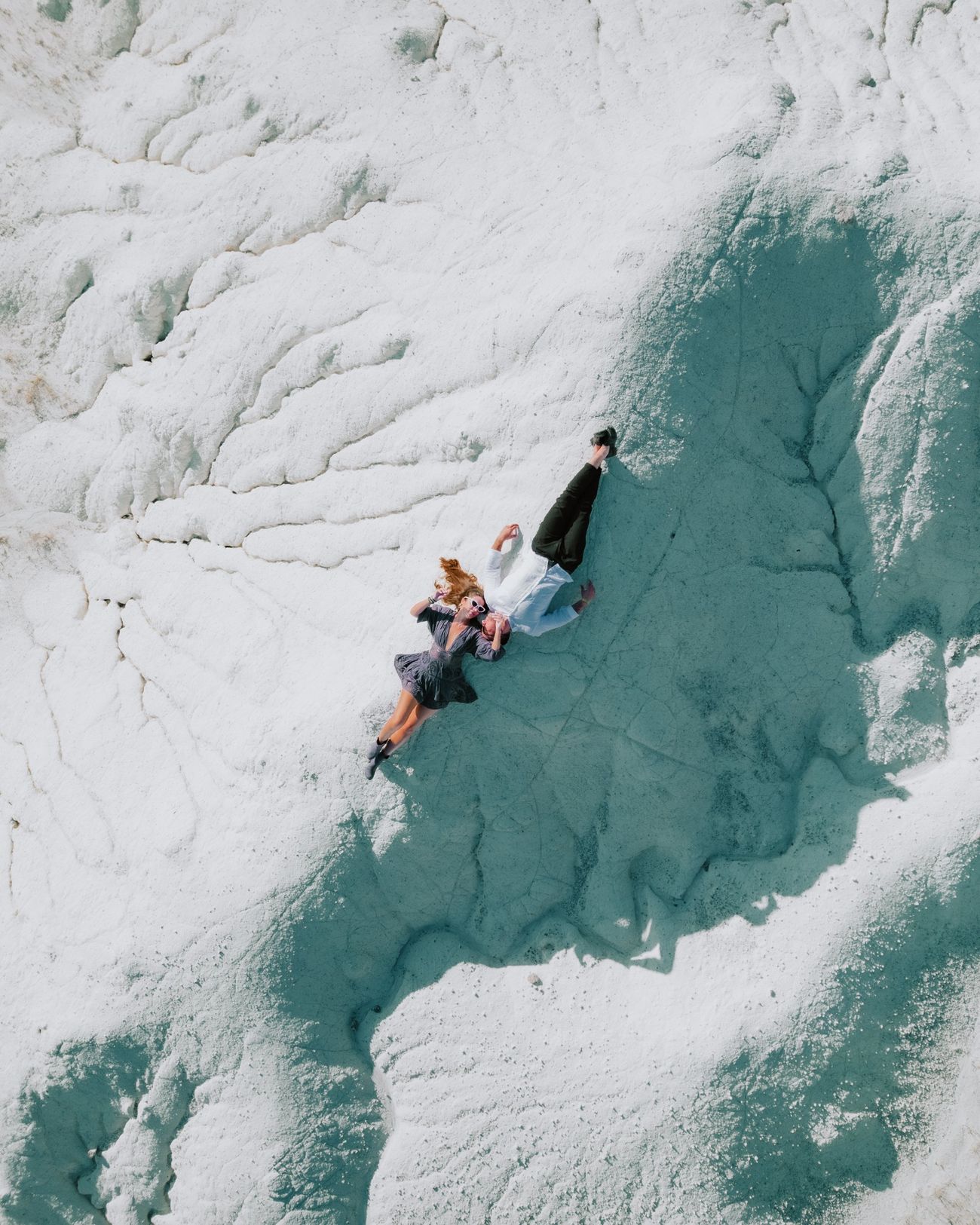 Aerial drone photography of a couple on white rock in Cappadocia