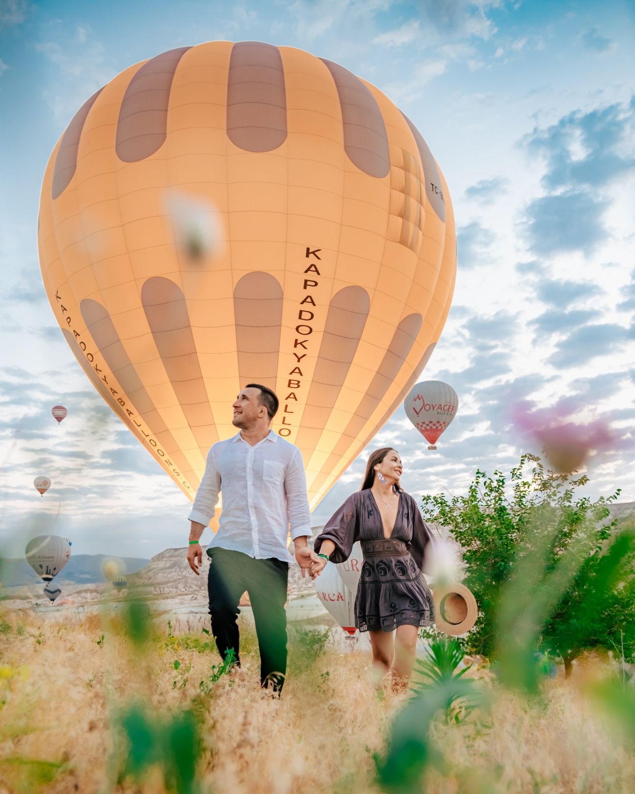 Cappadocia couples photographer, proposal photoshoot beside a hot air balloon