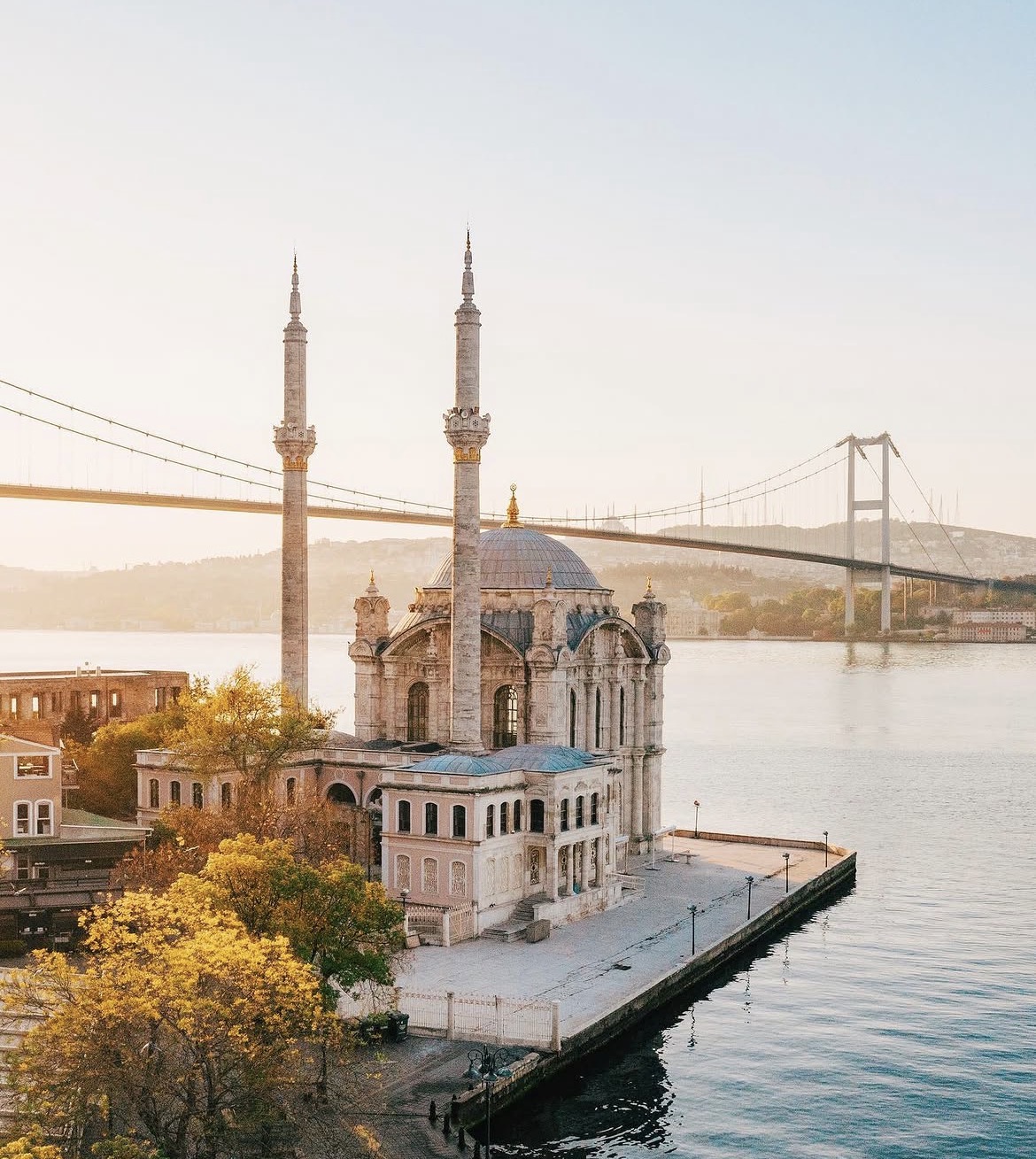 Ortaköy Mosque with its two minarets beside the Bosphorus Bridge in Istanbul