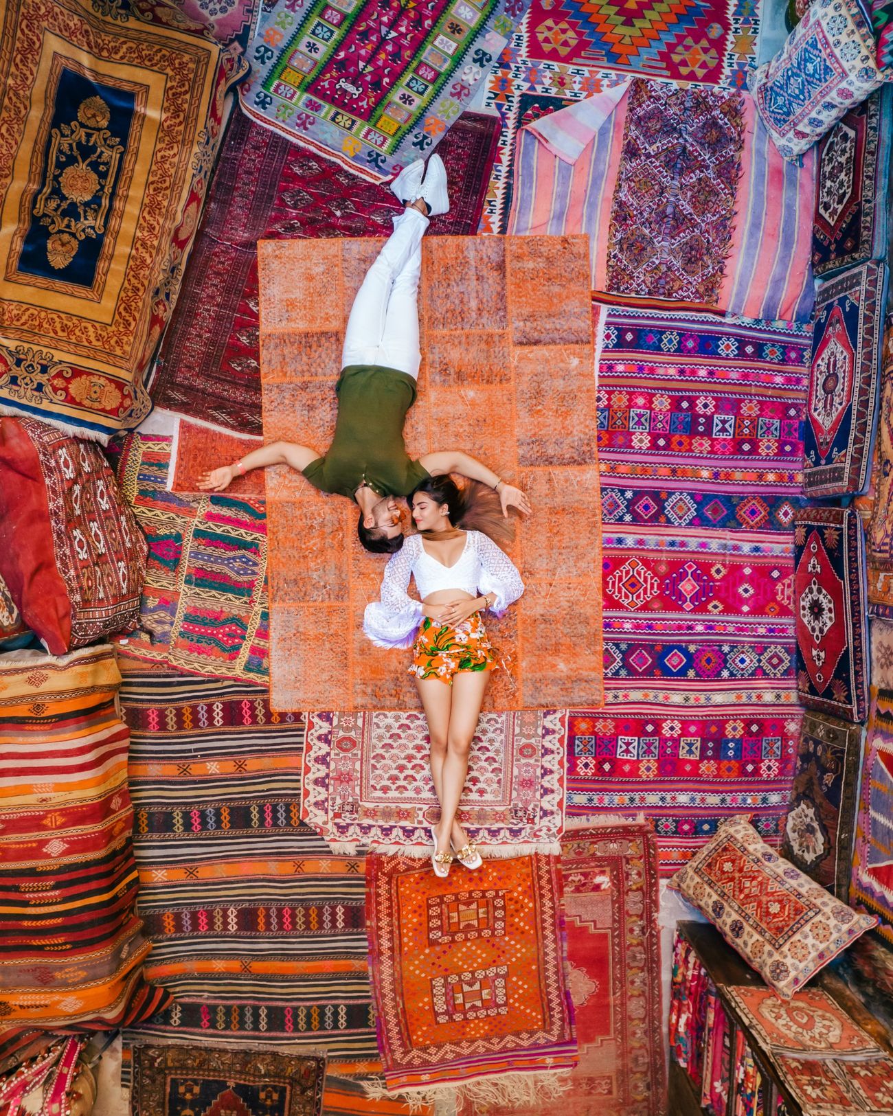 Aerial photo of a couple on Turkish carpets in Cappadocia